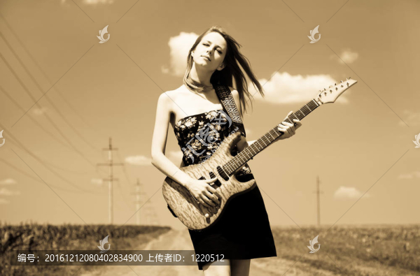 搖滾女孩在鄉(xiāng)村吉他。