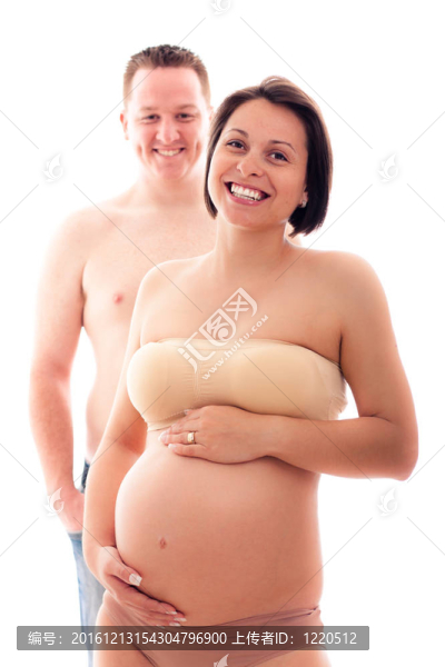 美麗的懷孕夫婦笑