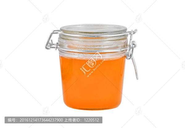 帶蜂蜜的玻璃罐；在白色背景上分離