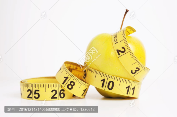 帶卷尺的青蘋果