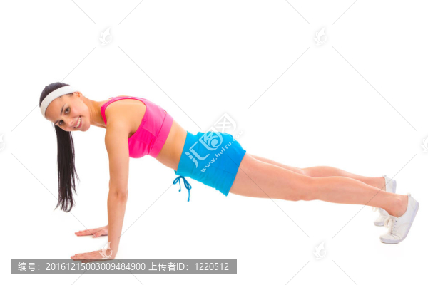 微笑的年輕Sportsgirl做俯臥撐白色隔離