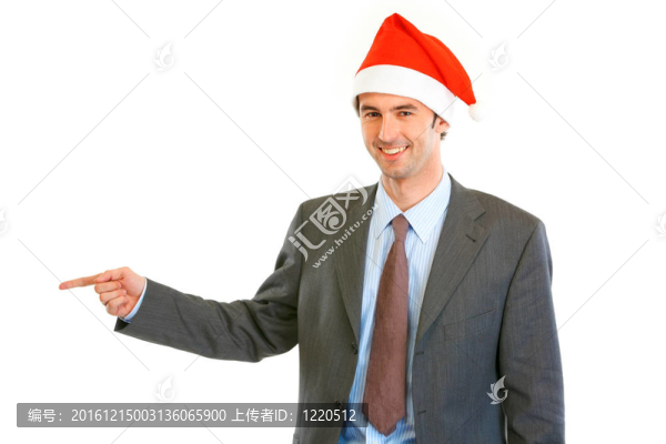 微笑的年輕商人在Santa帽子指著手指復(fù)制空間孤立在白色