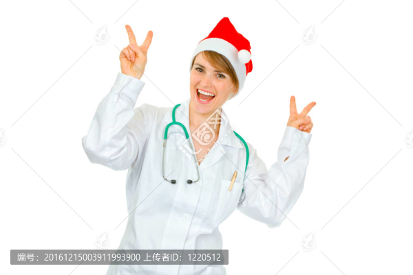 快樂的醫(yī)生在Santa女人的帽子顯示勝利的姿態(tài)孤立在白色