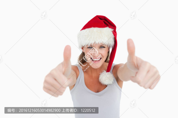戴著大拇指的女人和一頂圣誕帽