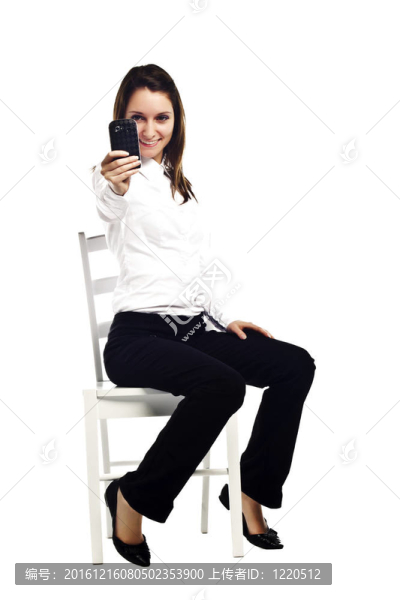 年輕漂亮的女商人的手勢拍照