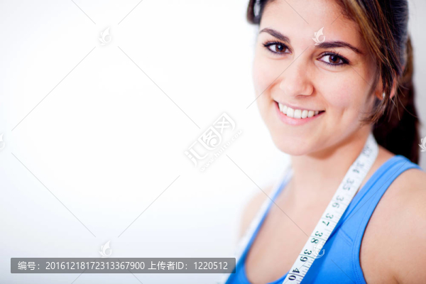 帶卷尺的婦女