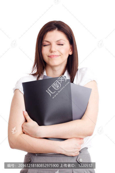 漂亮的女商人與文件夾在手