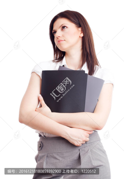 漂亮的女商人與文件夾在手