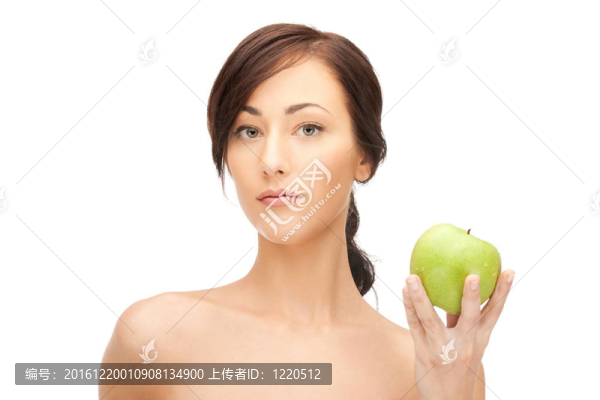 年輕漂亮的女人和綠色的蘋果