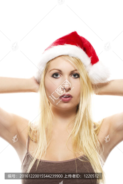 在白色背景上戴著圣誕老人帽子的漂亮金發(fā)女郎
