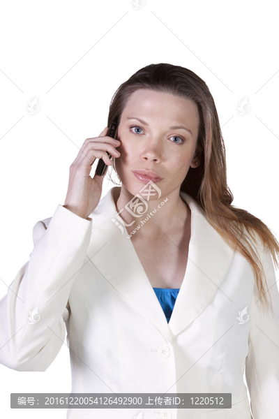 女商人在談?wù)摴ぷ魃系氖謾C(jī)