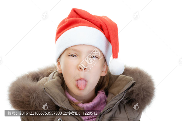 小女孩戴圣誕帽秀舌頭