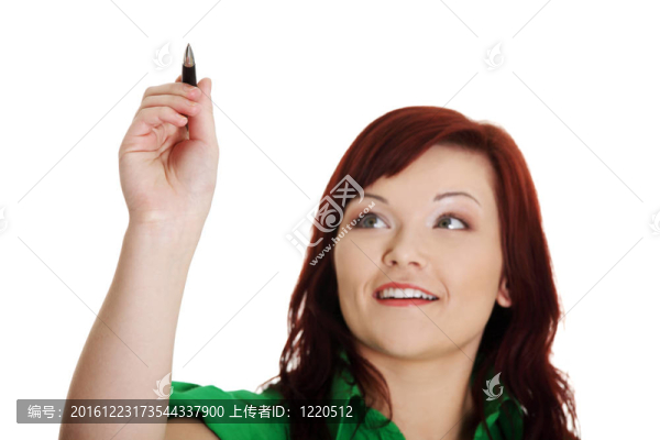 年輕漂亮的女學生用筆用筆抽象地寫著