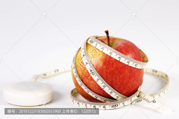 帶卷尺的蘋果