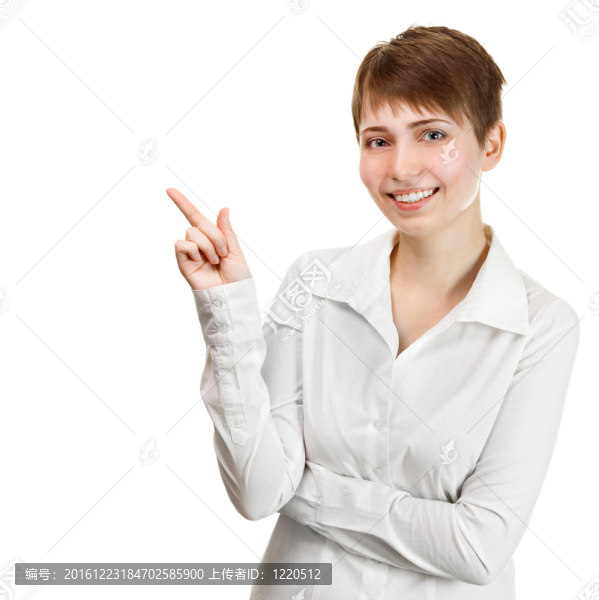 一個快樂的年輕女商人指著有趣的東西在白色背景的特寫肖像