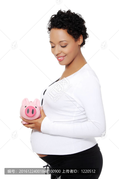 懷孕的女人與一個撲滿。