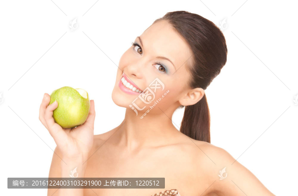 年輕漂亮的女人和綠色的蘋果