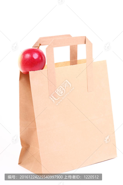 購物棕色禮品袋和蘋果隔離