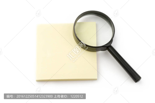 放大鏡和貼在白色上的貼紙