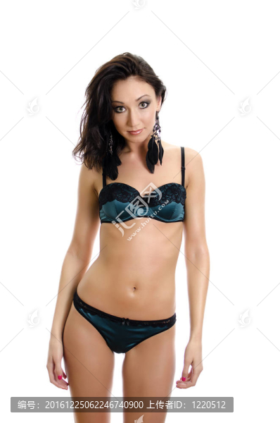 美麗的年輕女子穿著綠色內(nèi)衣。白色隔離。