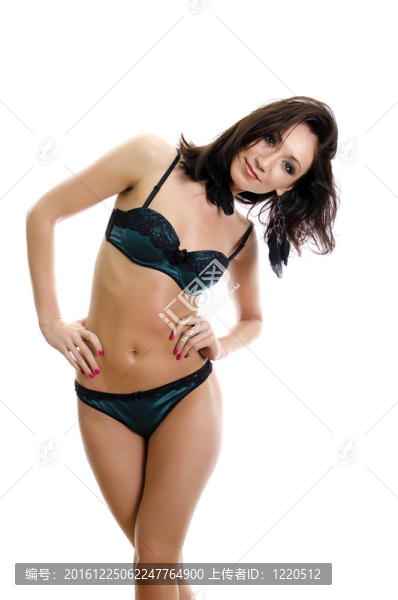 美麗的年輕女子穿著綠色內(nèi)衣。白色隔離。