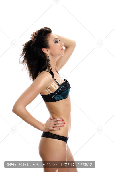 美麗的年輕女子穿著綠色內(nèi)衣。白色隔離。