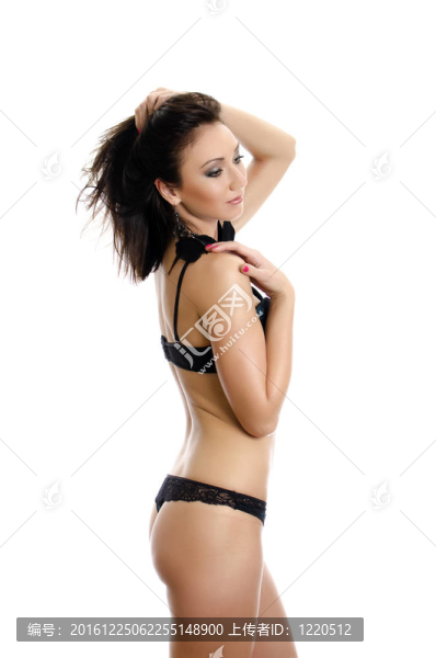 美麗的年輕女子穿著綠色內(nèi)衣。白色隔離。