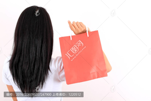 年輕模特手拿購(gòu)物袋