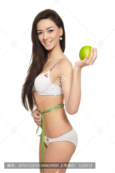美麗的微笑的黑發(fā)白衣女人內(nèi)衣蘋果綠測量完美形狀孤立在白色的肖像