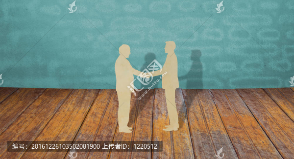 剪紙的兩個商人握手