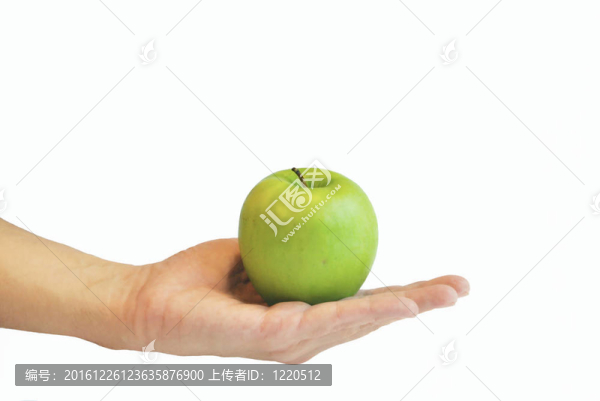 綠色的蘋果在手掌上