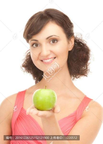 年輕漂亮的女人和綠色的蘋果