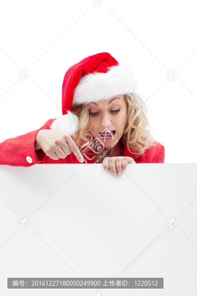 美麗的女人在圣誕帽與留言板