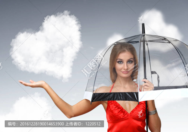 漂亮的年輕女人帶著雨傘和心
