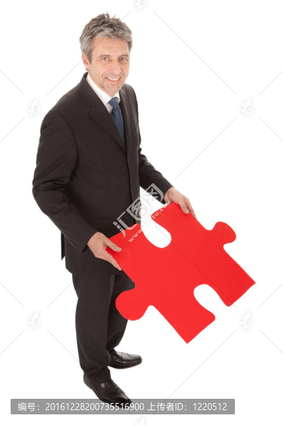 資深商人拿著拼圖