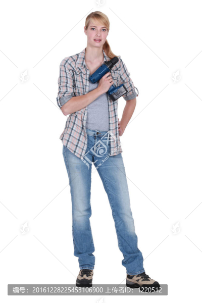 拿著電動工具的女人