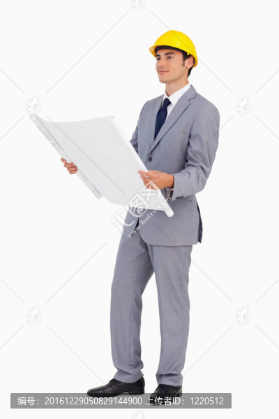 穿著安全帽和計(jì)劃的漂亮男子