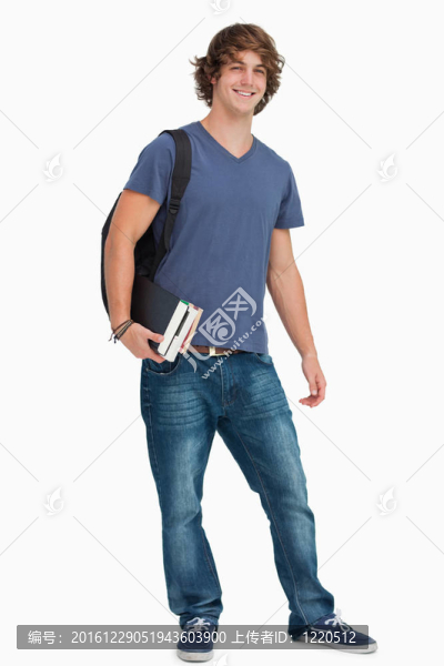 一男學生背背包書的畫像