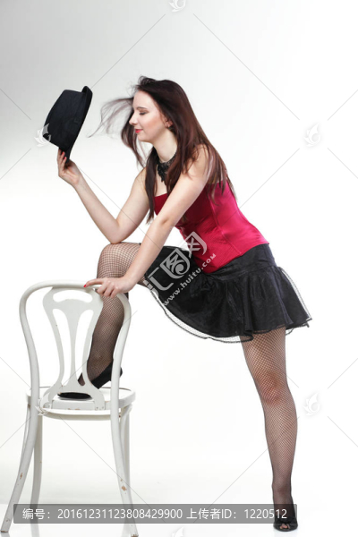 在紅色的緊身衣椅白孤立女人跳舞女郎