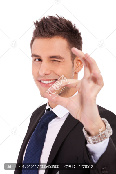 生意人眨眼和OK的手勢