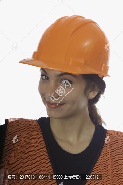 安全帽的工人與女士背心