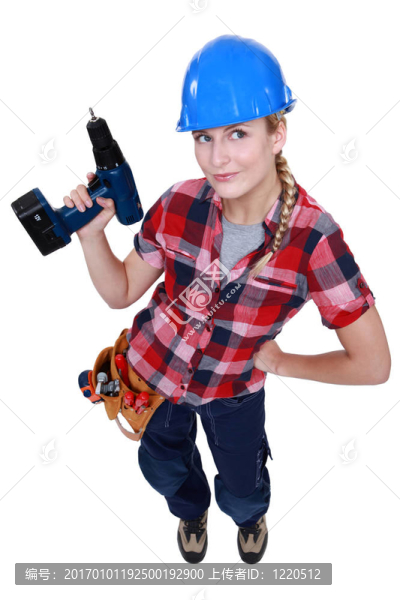 女建筑工人拿著鉆。