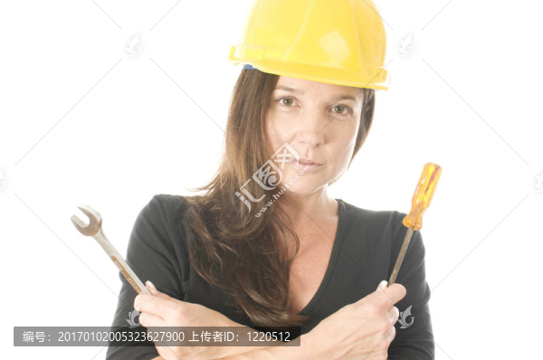 女承包商承包商與保護帽頭盔和工具