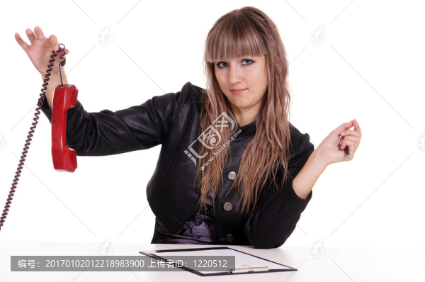 桌上的女孩與電話