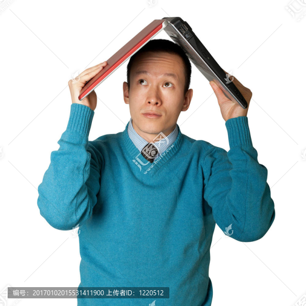 年輕商人藏在筆記本電腦下