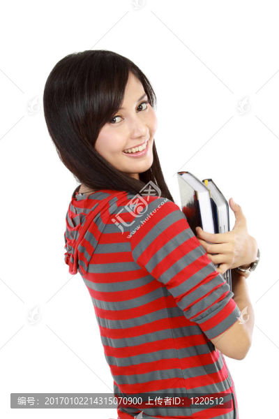 可愛的亞洲女孩拿書