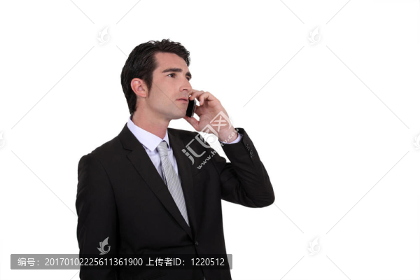 商人用手機(jī)交談