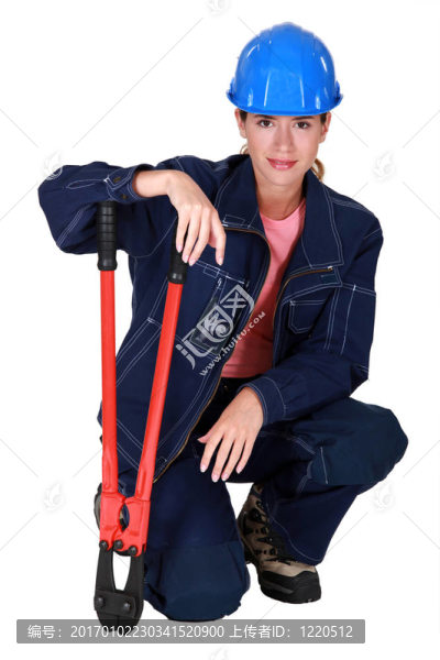 帶鉗子的女建筑工人。