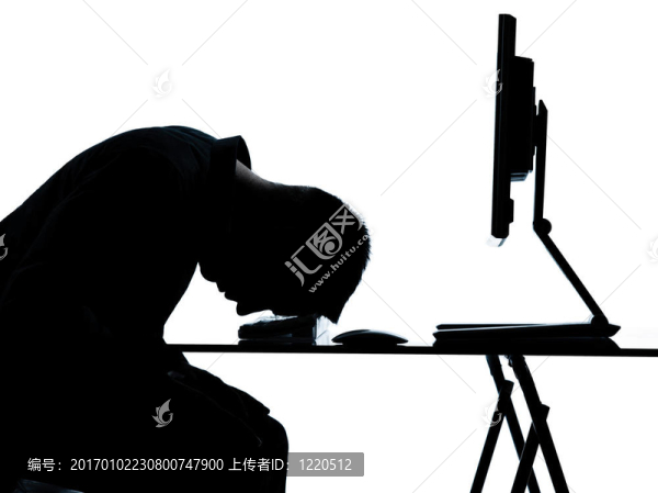 一位商業(yè)人士剪影電腦計算睡覺累