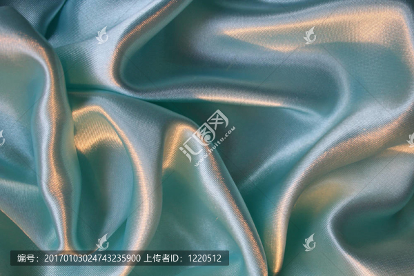 光滑優(yōu)雅的藍(lán)色絲綢為背景